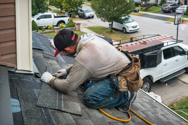 Professional Storm Damage Roof Repair technician working in Lynnville, IA